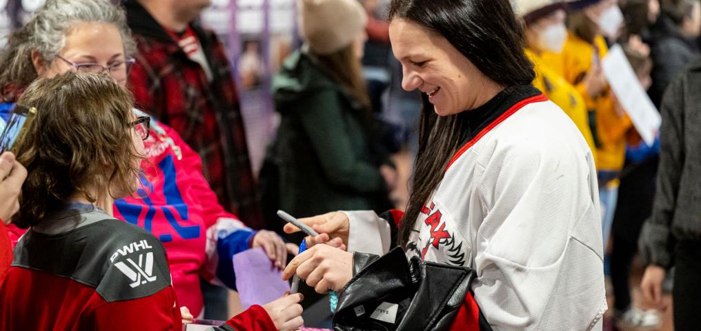 PWHL fans greet players as they arrive at Scotiabank Centre and receive autographs