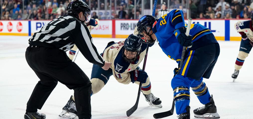 A face off is taken during the Montreal vs Toronto PWHL game